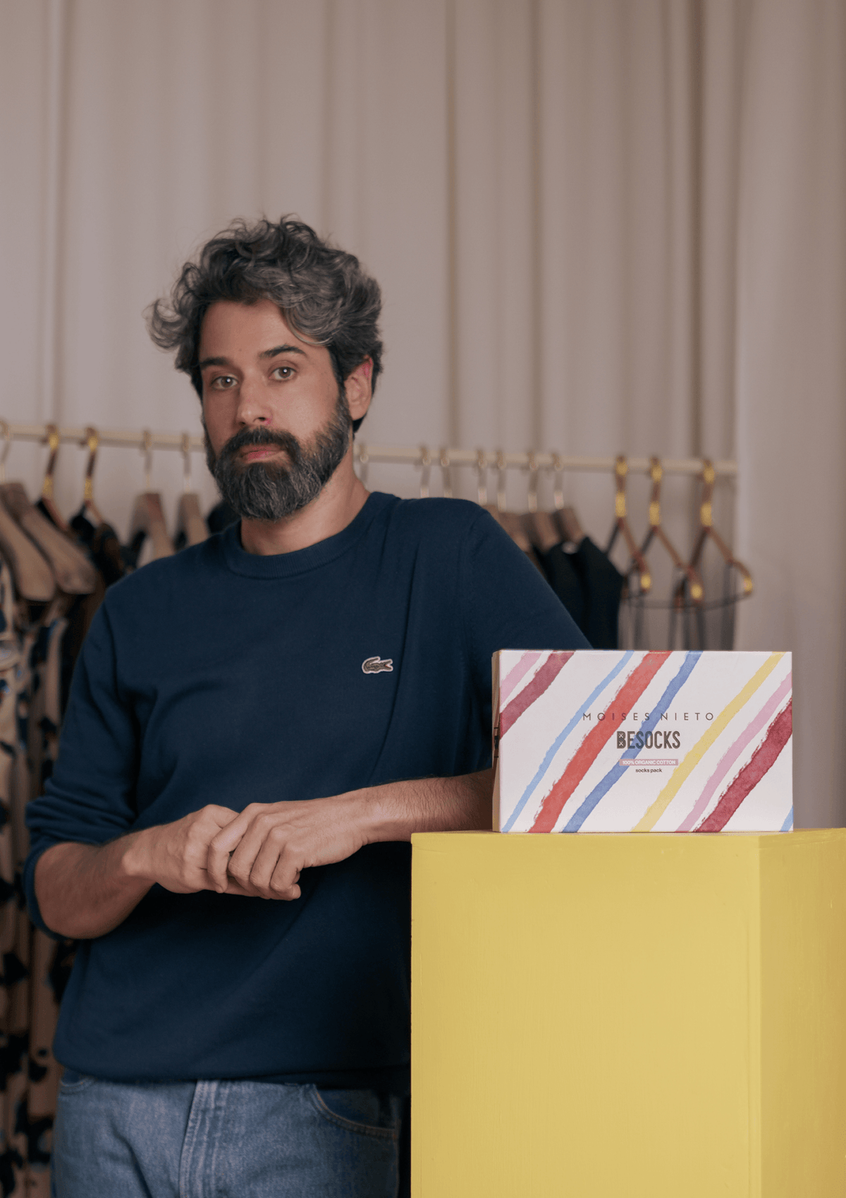 MOISES NIETO X BESOCKS displayed with a stylish product box in a modern fashion setting.