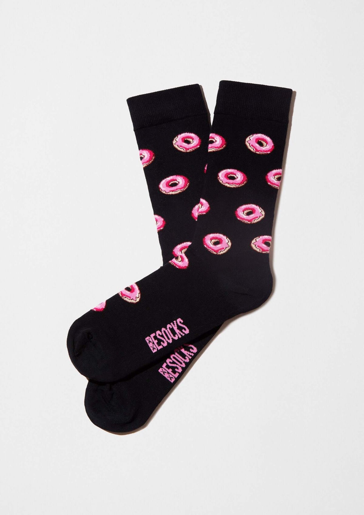 Calcetines BeDonut Black con diseño de donuts rosa sobre fondo negro, originales de BESOCKS.