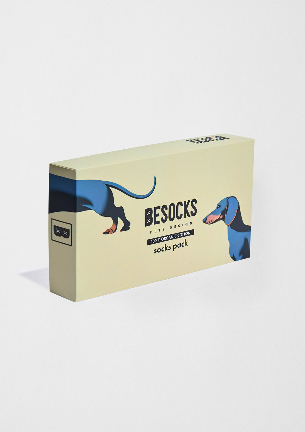 Pack Pets de calcetines en caja con diseños de perro teckel, en algodón orgánico, fondo camel.