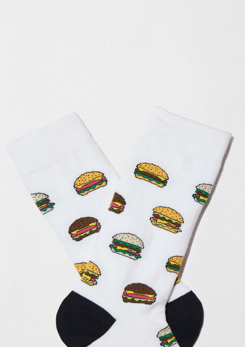 Calcetines BeBurger de algodón orgánico en blanco con dibujos de hamburguesas en colores variados y detalles negros.