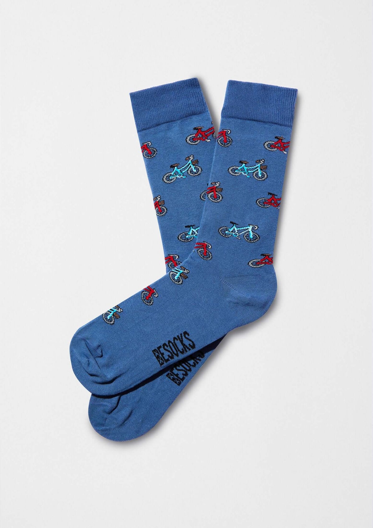 calcetines originales BeBicycle Blue con dibujos de bicicletas en azul y rojo sobre fondo azul.