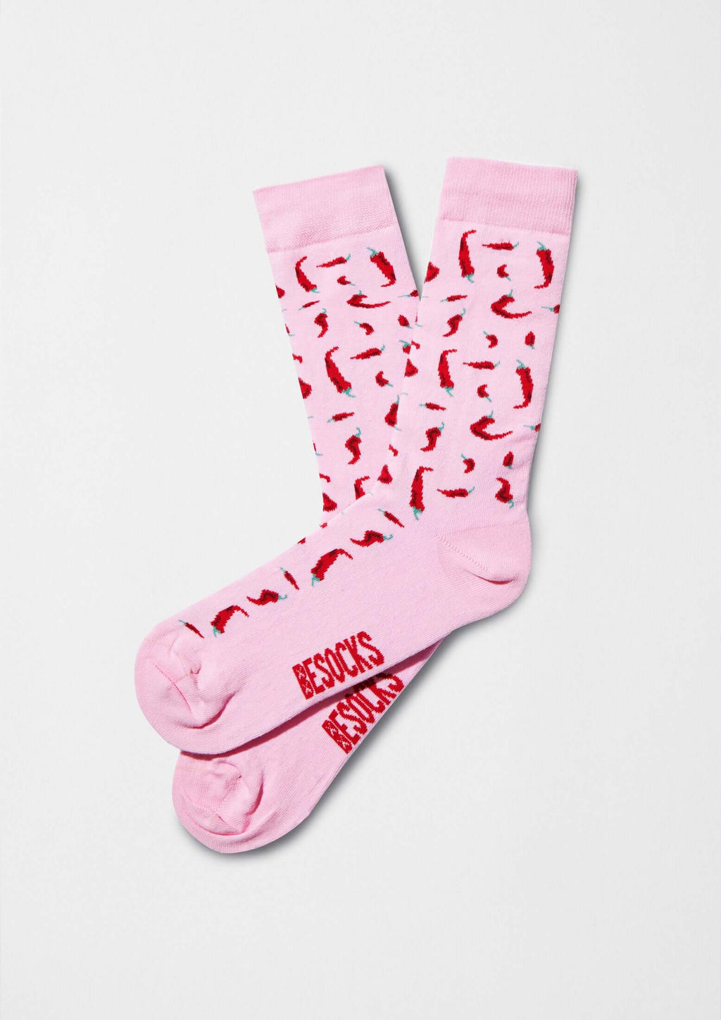 Calcetines BeChili Pink con dibujo de chiles rojos sobre fondo rosa claro, logo BESOCKS en rojo.
