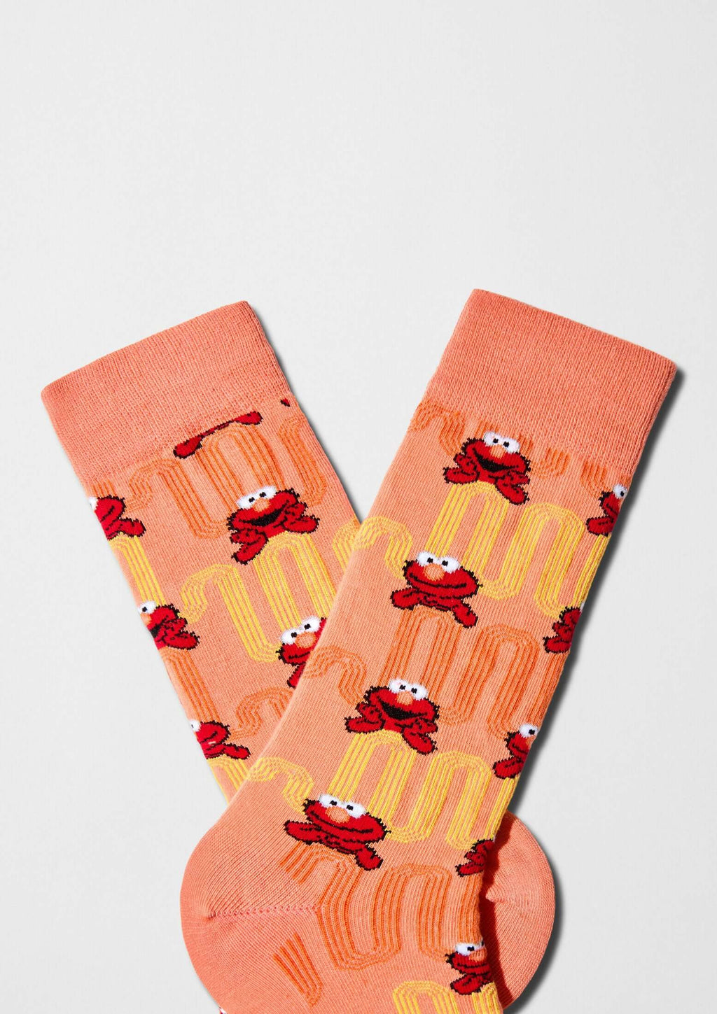Estampado de Elmo con líneas onduladas en colores naranja y amarillo - BESOCKS. calcetines BeSesameStreet Elmo Zigzag