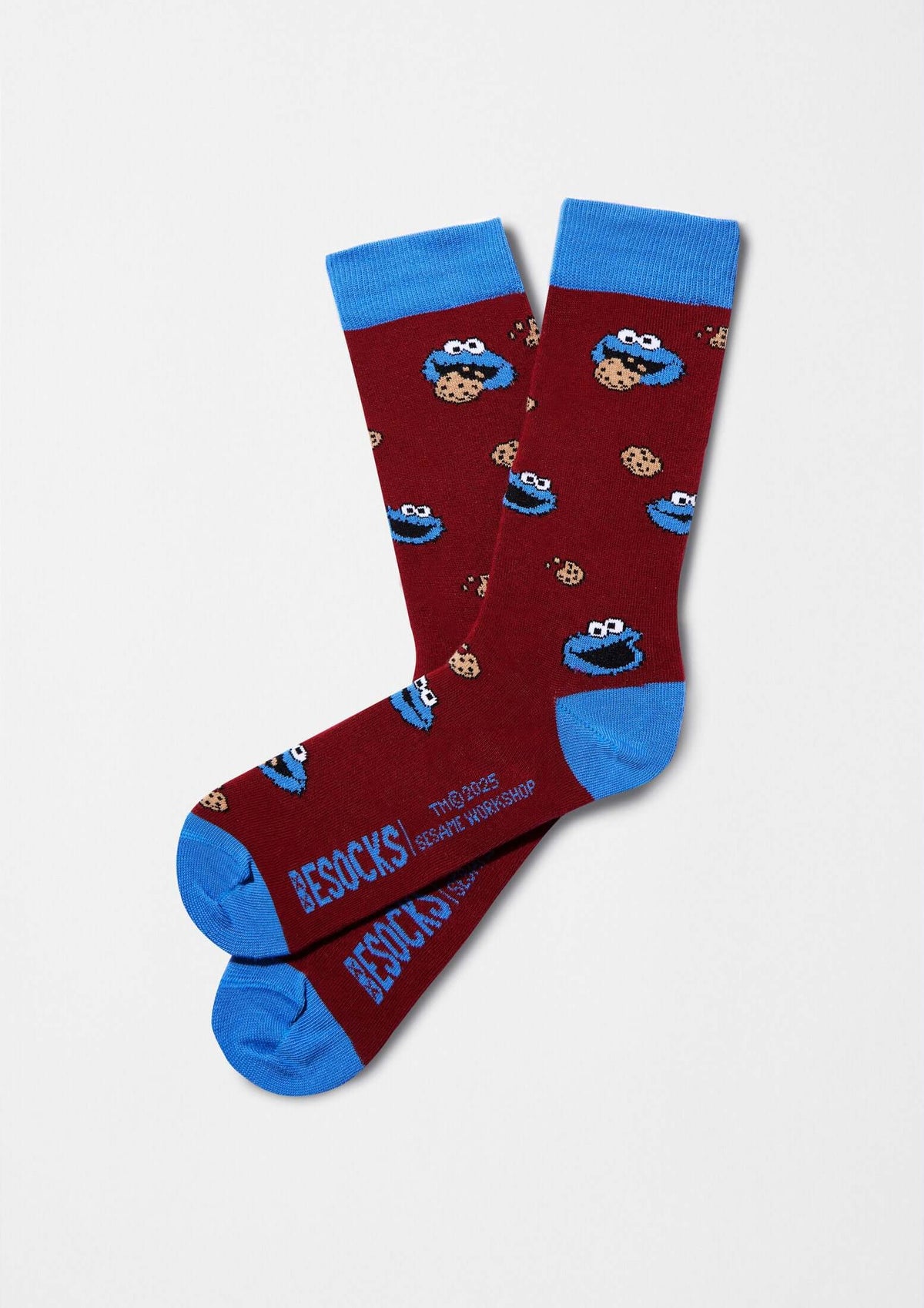 Calcetines BeSesameStreet Cookie Monster burgundy con patrón de Cookie Monster y galletas, altura media caña, puños azules.
