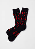 Calcetines BeChili Black con patrón de chiles rojos sobre base negra y logo BESOCKS en rojo.