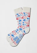 Caras de Elmo y Triki en color rojo y azul sobre base off-white - BESOCKS. calcetines BeSesameStreet Elmo & Cookie Faces.
