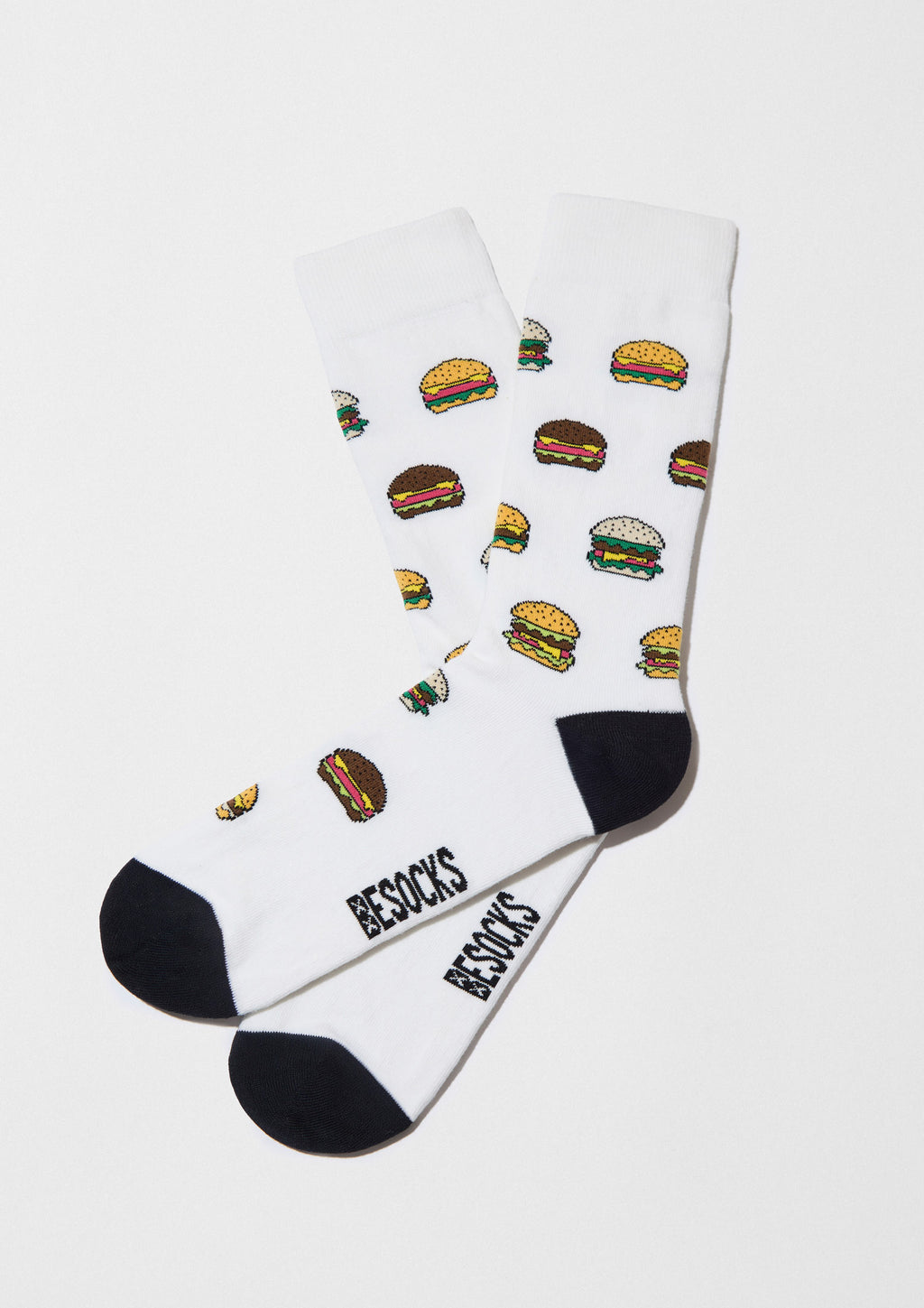 Calcetines BeBurger de BESOCKS con ilustraciones de hamburguesas sobre fondo blanco, parte de la colección Pack Food.