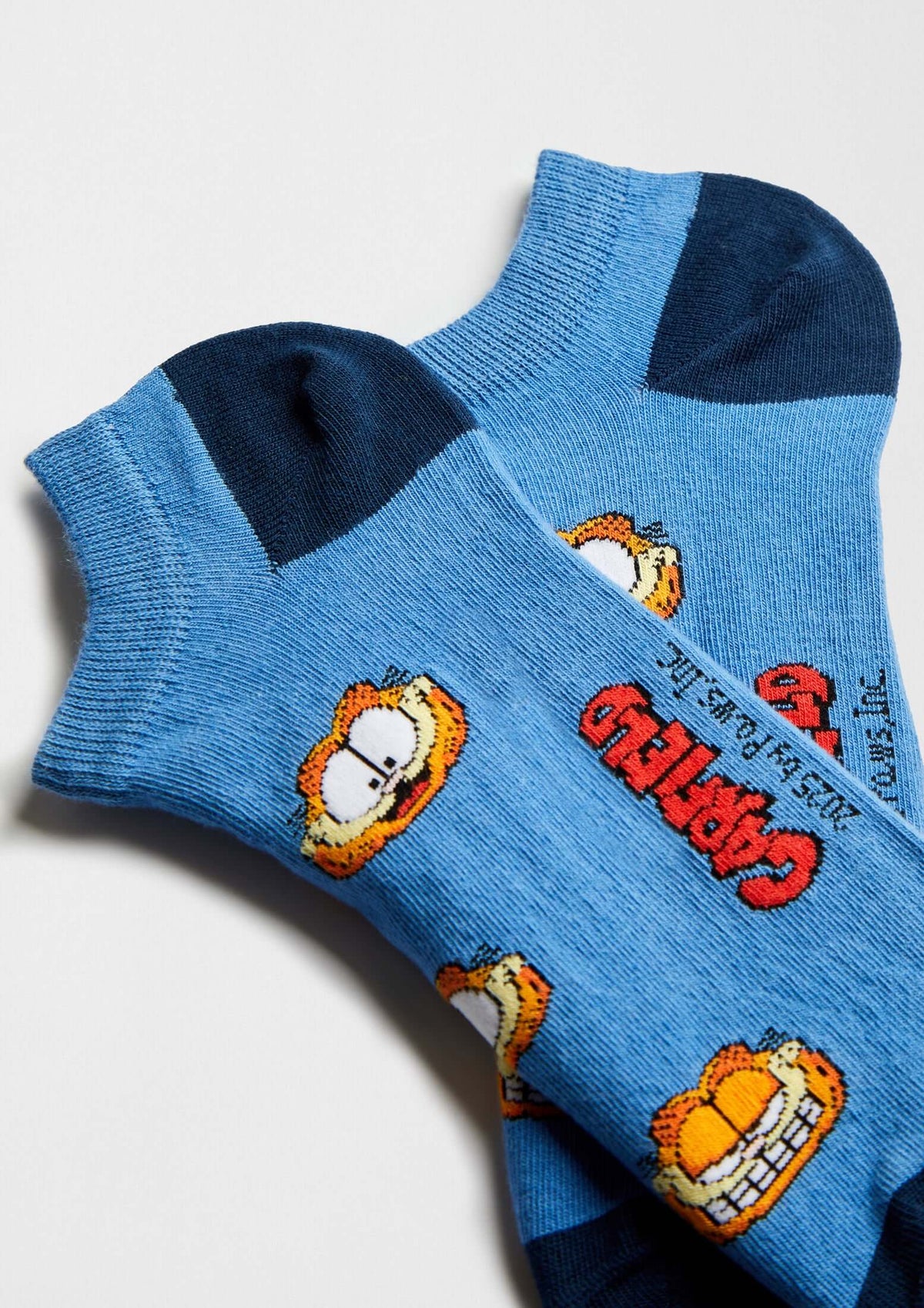 BeGarfield Faces Blue Ankle, calcetines tobilleros en azul claro con motivo de Garfield en naranja.