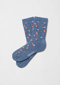 Calcetines BeLiberty Blue de caña baja en azul jaspeado con flores rojas y verdes.