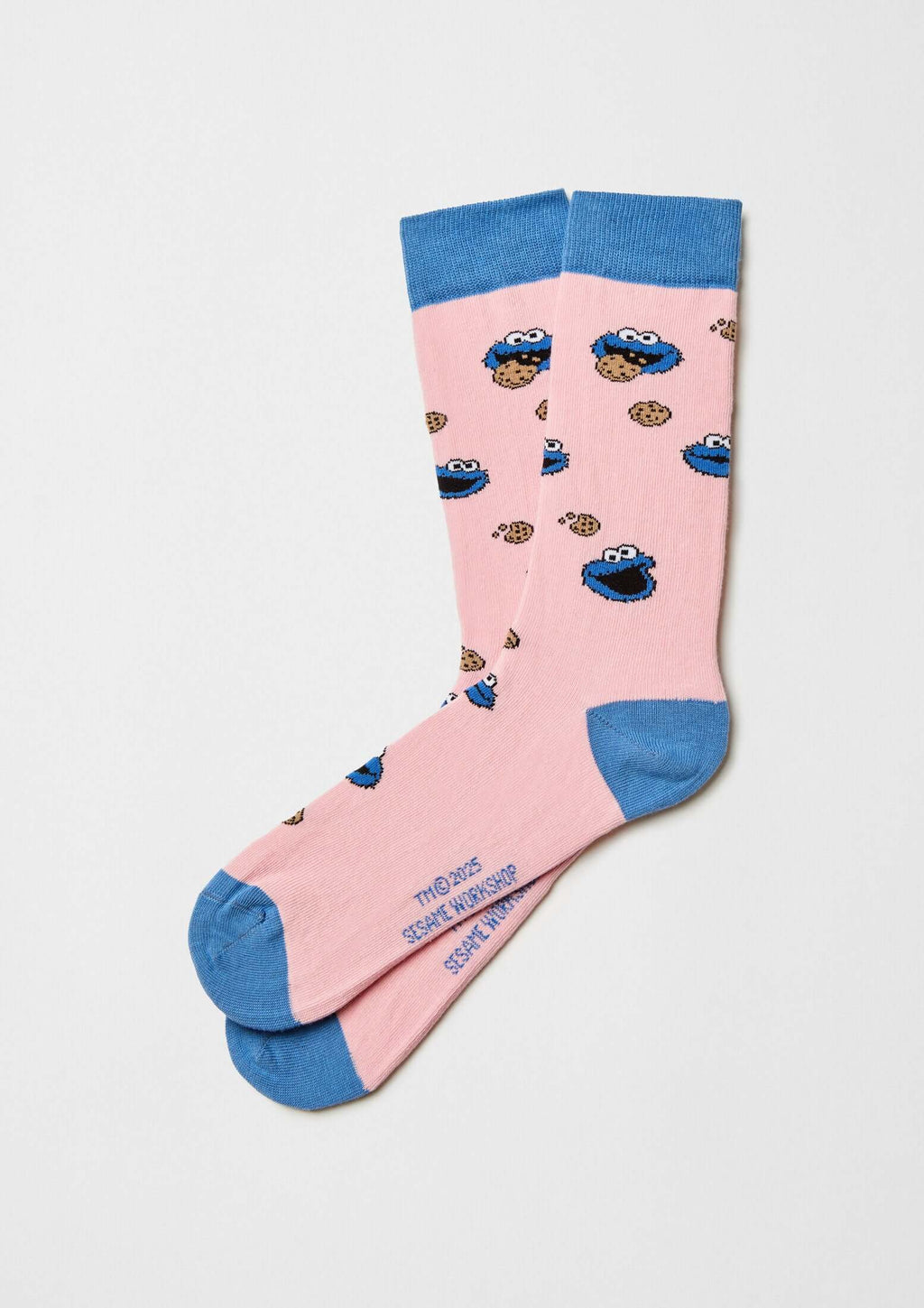 Calcetines BeSesameStreet Cookie Monster Pink en rosa con personaje y galletas, acabado en azul celeste, tobilleros.